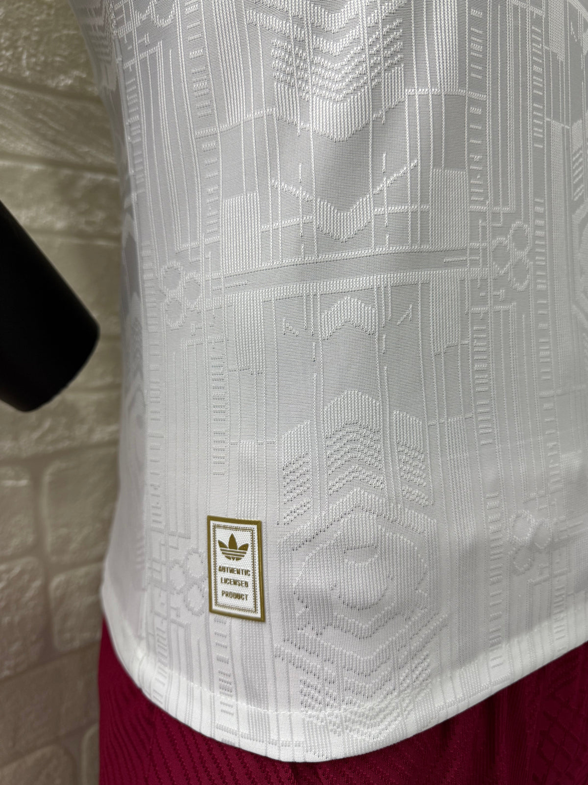 2025/26 Arsenal Third Player Version Jersey - White Body All-Over Subtle Tonal Graphic Texture Deep Maroon Polo Collar Gold Cream Stripe Trim Deep Maroon Sleeve Cuff Trim - Originals Trefoil - Arsenal Cannon Crest - Emirates Fly Better