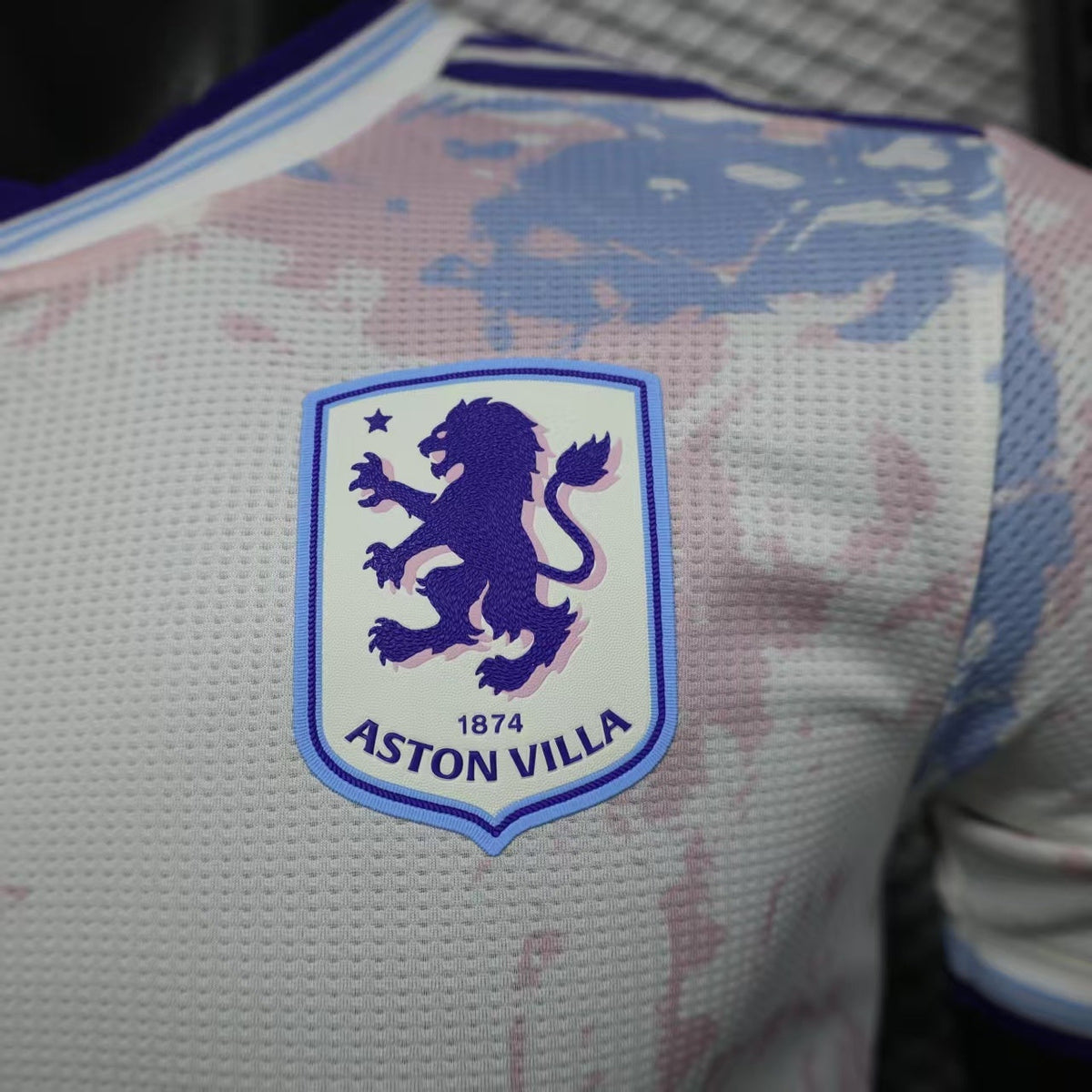 2025/26 Aston Villa Away Player Version Jersey - White Body All-Over Blue Pink Watercolour Wash Camo Graphic Dark Navy V-Neck Collar Dark Navy Sleeve Cuff Trim - Originals Trefoil - Aston Villa Lion Shield Crest - Betano - Men's